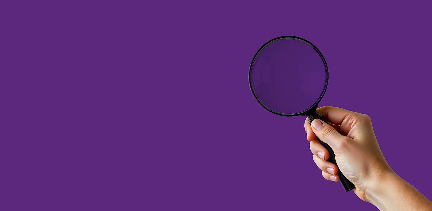 Magnifying glass on purple background